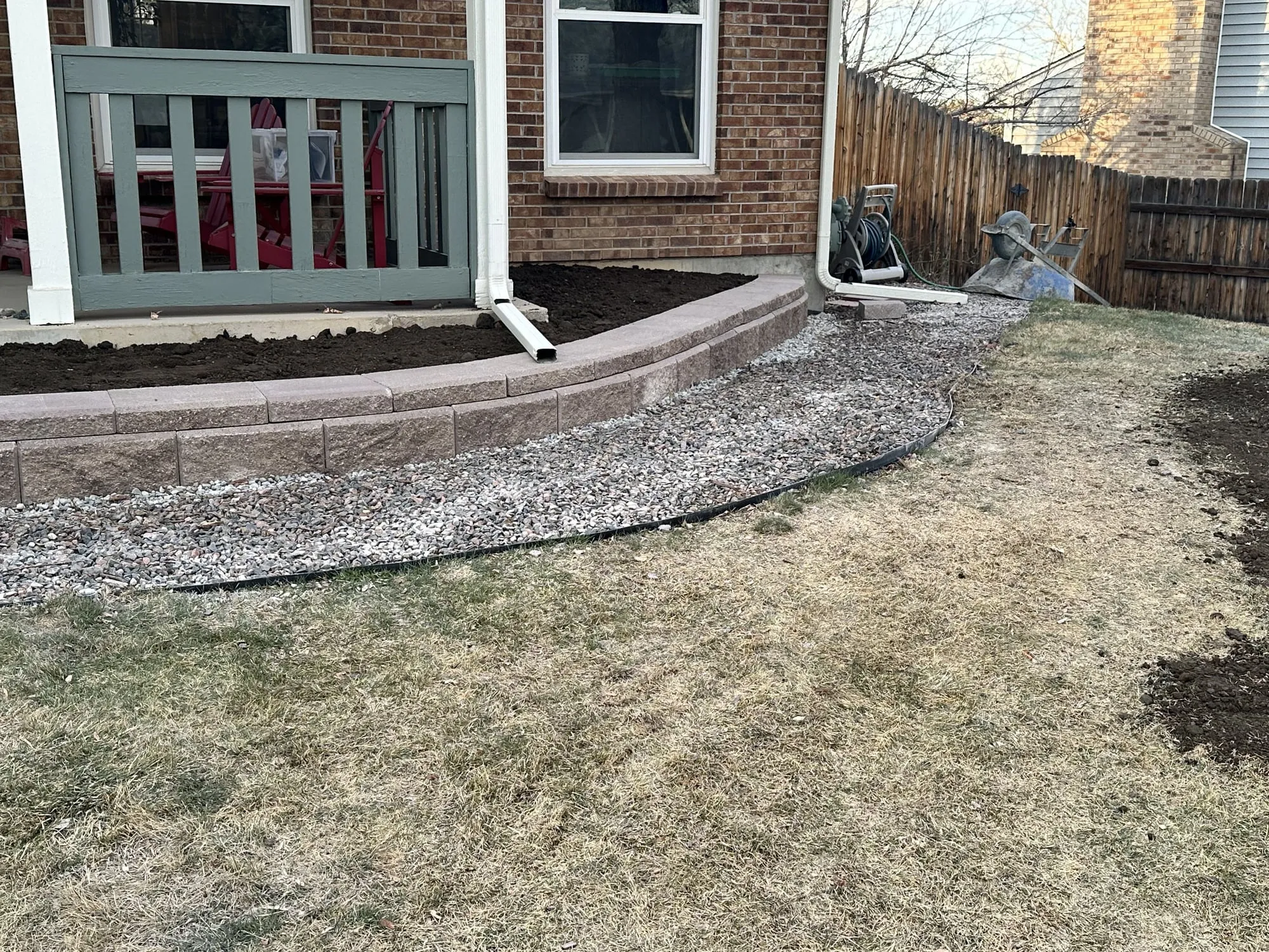 Curving flagstone walkway through a landscaped backyard