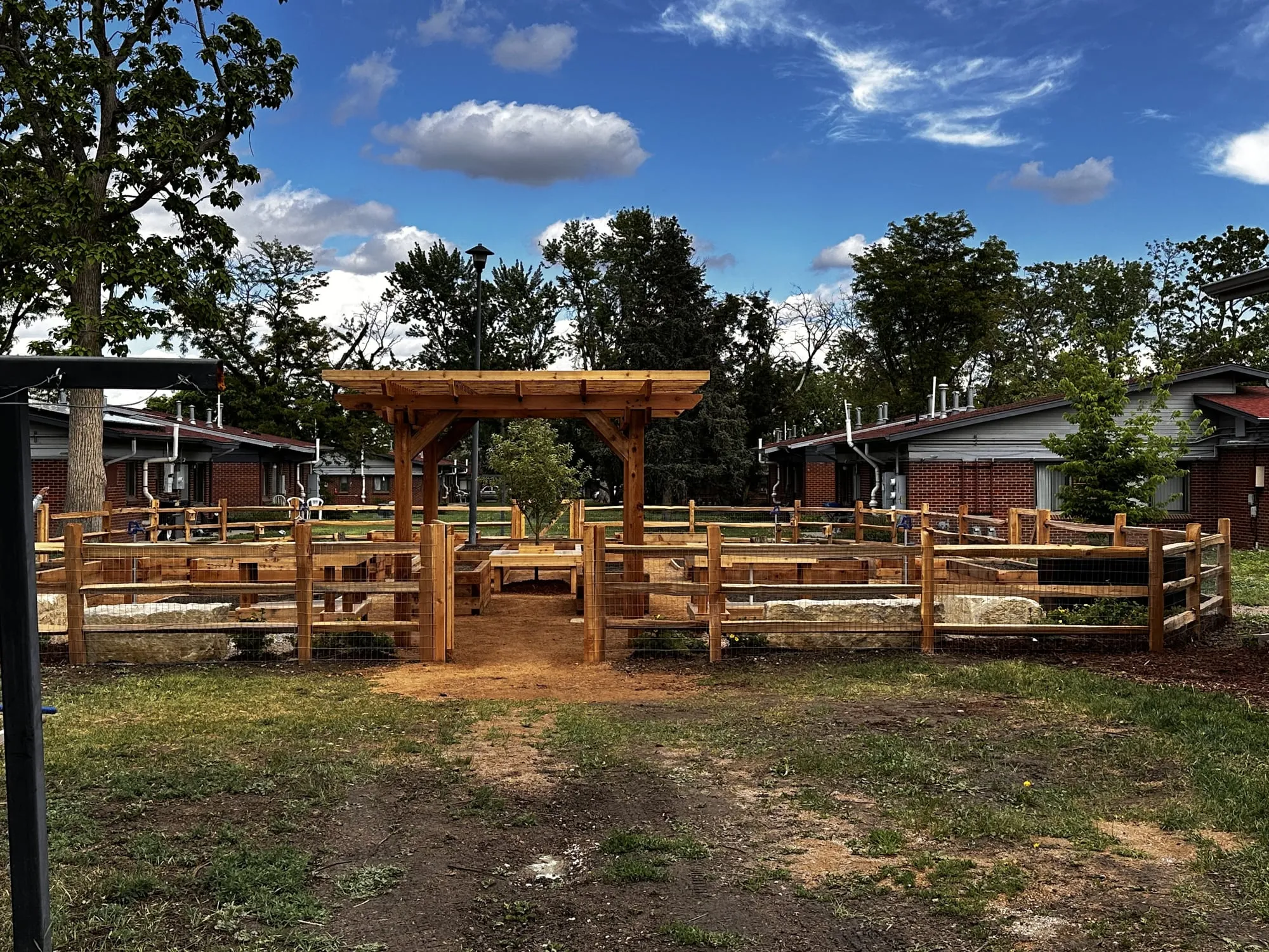 Cedar pergola over custom raised garden beds