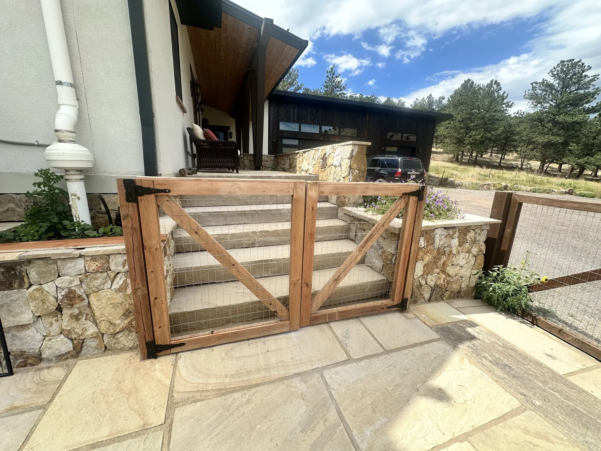 Custom wood gate and flagstone garden entry